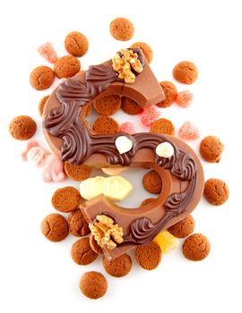 Decorated Chocolate letter S for Sinterklaas with ginger nuts, typical Dutch party in december, isolated on white background