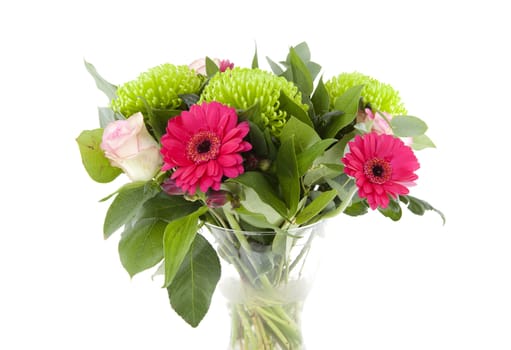 Bouquet of pink flowers in vase over white background
