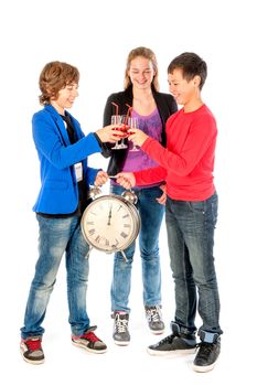 Cheers! on twelve o'clock on new year's eve, three teenagers celebrating New Year