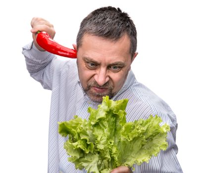 Healthy food. Joy of vegetarianism. A man with a salad and red pepper. Isolated on white