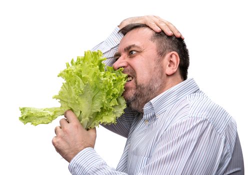 Healthy food. Man holding lettuce isolated on white