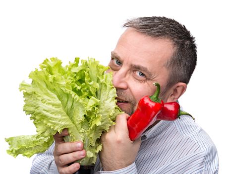 Healthy food. Joy of vegetarianism. A man with a salad and red pepper. Isolated on white