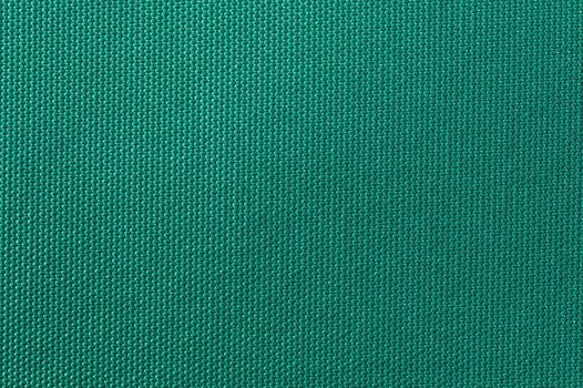 Weaved textile background on green base