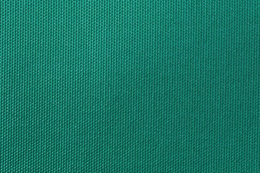 Weaved textile background on green base