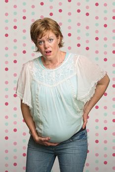 Single pretty young pregnant woman having contractions
