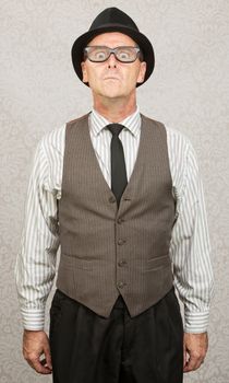 Scared stiff businessman with hat and eyeglasses