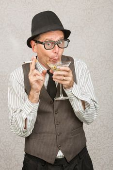 Giddy man holding cigarette and martini with hat and eyeglasses