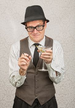 Awkward tipsy business man with cigarette and martini