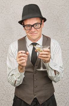 Drunk businessman holding martini and cigarette