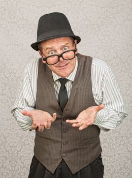 Single businessman in hat and eyeglasses with open hands