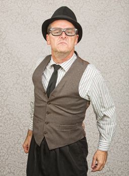 Bragging single businessman with hat and eyeglasses