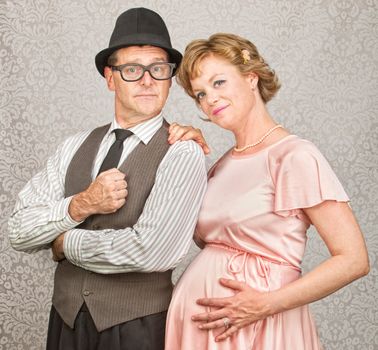 Cute smiling confident pregnant 1950s retro couple