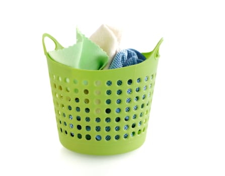 fabric in green plastic basket isolated on white