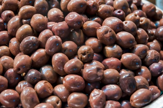 Green spicy olives .Closeup of olives on market stall .