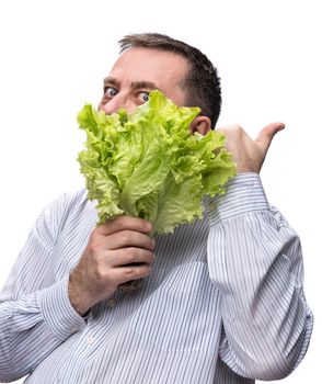 Healthy food. Man holding lettuce isolated on white