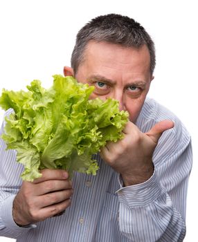 Healthy food. Man holding lettuce isolated on white