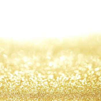 Golden shiny glitter holiday celebration background with white copy space
