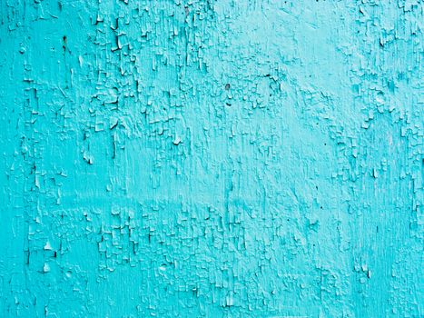 Grungy cracked and chipping blue paint background texture pattern abstract