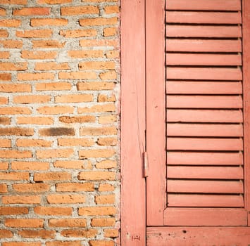 Close up wooden door and brick wall