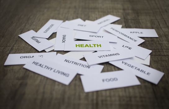 Paper strips with Healthy Concept related words on wooden background