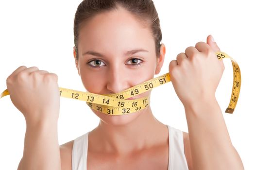 Woman with a yellow measuring tape around her mouth, isolated in white