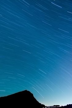 Star Trails with silhouette of mountain, famous Hehuan East Peak in Taiwan, Asia.