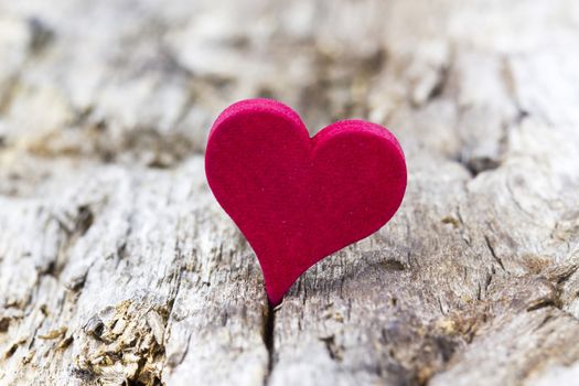 red heart on wooden background