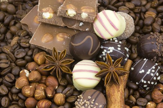background with chocolate, coffee, spices and nuts