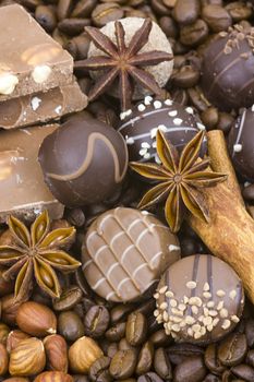 background with chocolate, coffee, spices and nuts