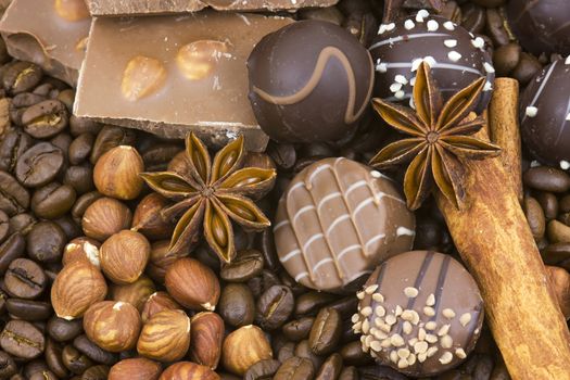 background with chocolate, coffee, spices and nuts 