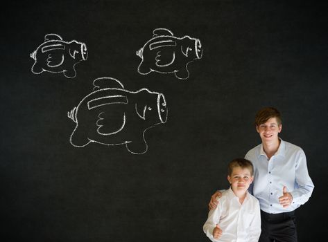 Young business boy with flying money piggy banks in chalk on blackboard background