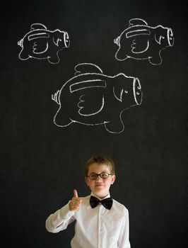 Thumbs up young business boy with flying money piggy banks in chalk on blackboard background