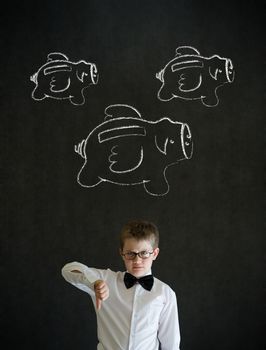 Thumbs down young business boy with flying money piggy banks in chalk on blackboard background