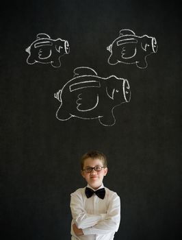 Young business boy with flying money piggy banks in chalk on blackboard background