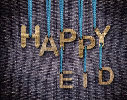 Happy Eid letters hanging strings with blue sackcloth background.