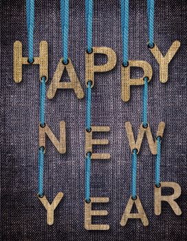 Happy New Year Letters hanging strings with blue sackcloth background.