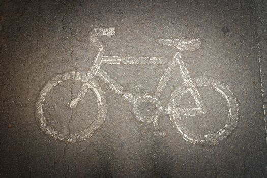 white painted sign for bikes lane