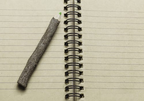 notebook and wooden pencil, conservation concept