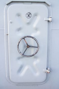 Iron ship door with lock wheel