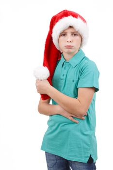 teenager wit red santa hat and bored expression on his face