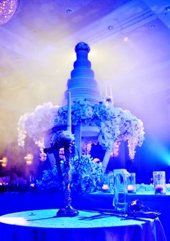 Wedding candlestick with romantic wedding cake background in ceremony