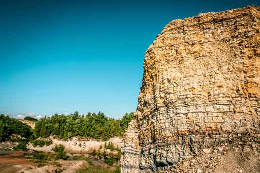 Canyon surrounded by forest with blue sky