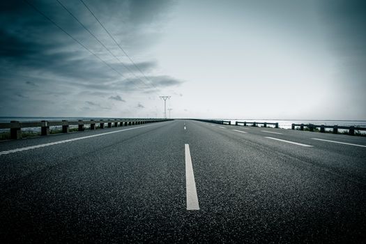 Dark highway in cloudy weather