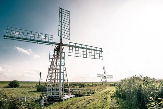 Old windmill in countryside scenery