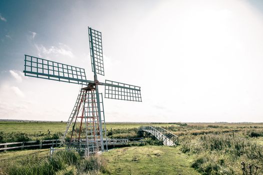 Old windmill in countryside scenery