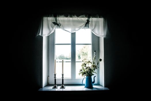 Romantic window with beautiful curtains and decorations