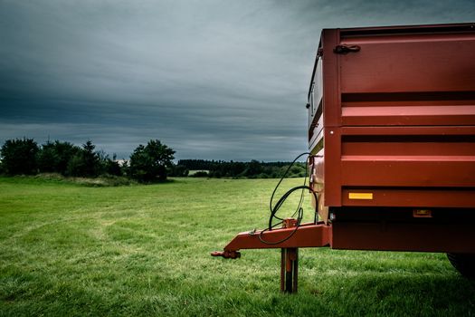 Industrial machine on grass and cloudy weather