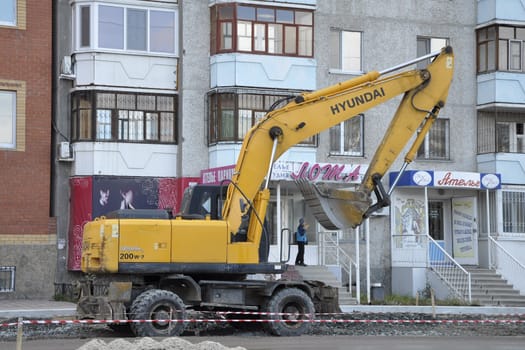 The special equipment on a construction of roads. Excavator.