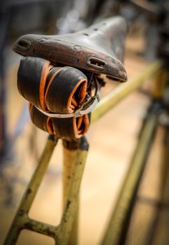 A Vintage Bicycle With An Inner Tube UNder The Seat