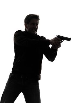 one man killer policeman aiming gun portrait silhouette studio white background